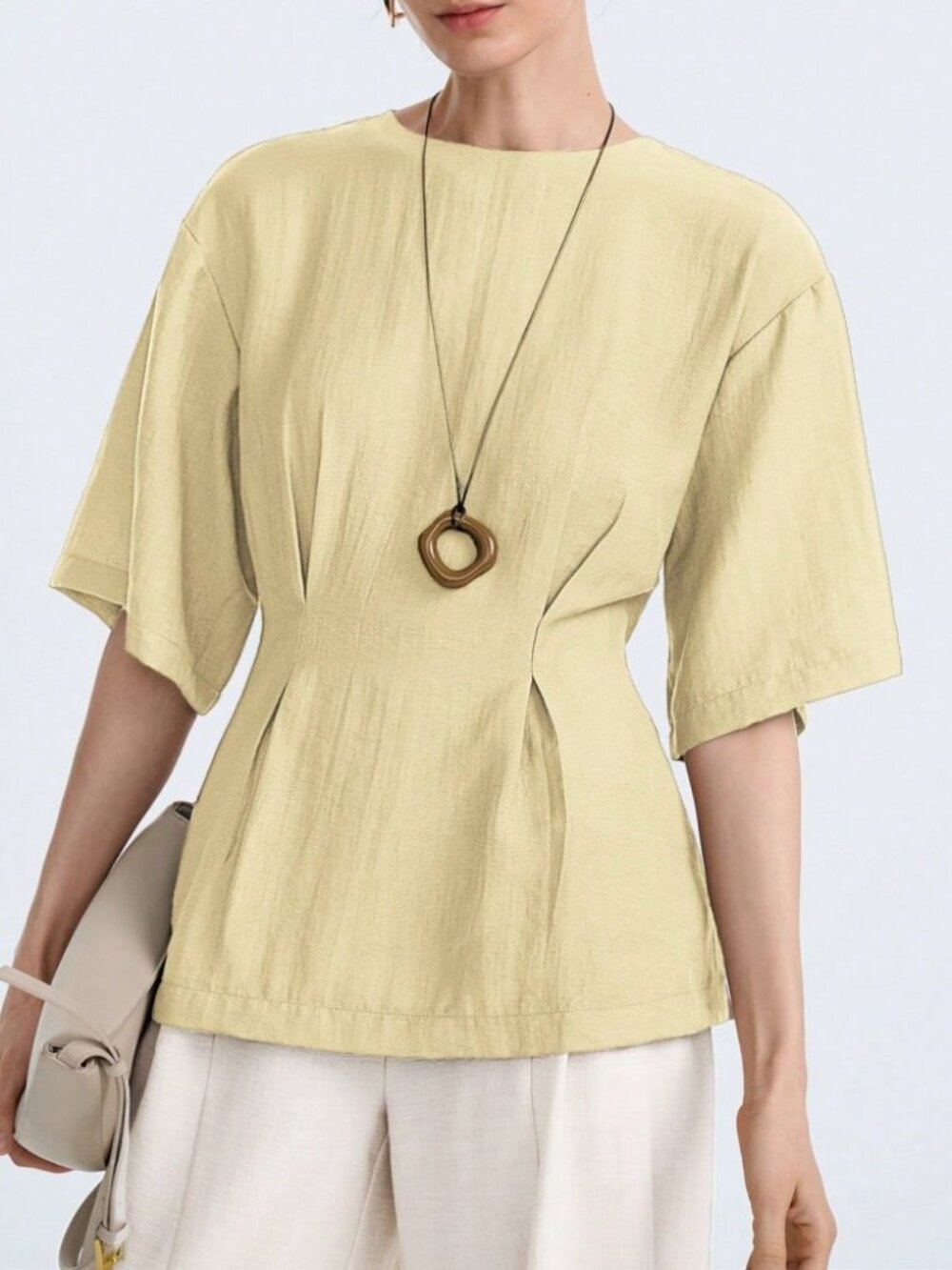 Pale Yellow Round Neck Blouse with Pleated Waist Seam